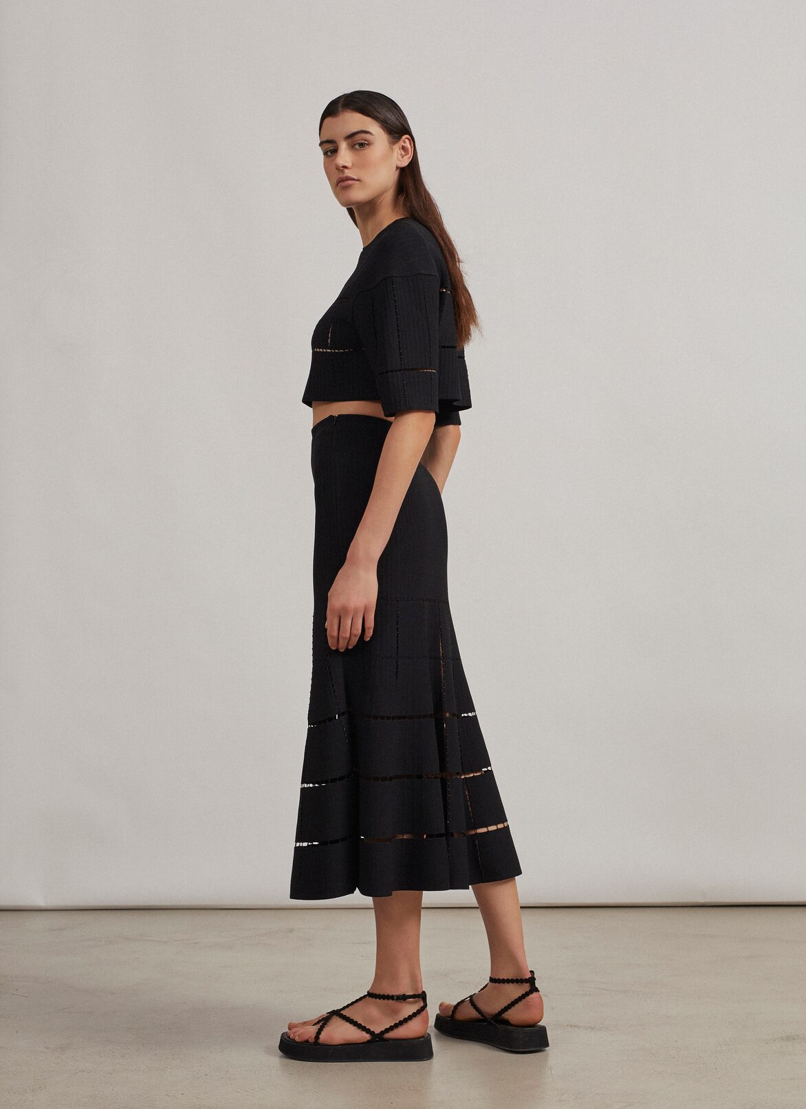 Flared skirt in knit and raffia ALAÏA BLACK FLARED SKIRT IN KNIT AND RAFFIA
